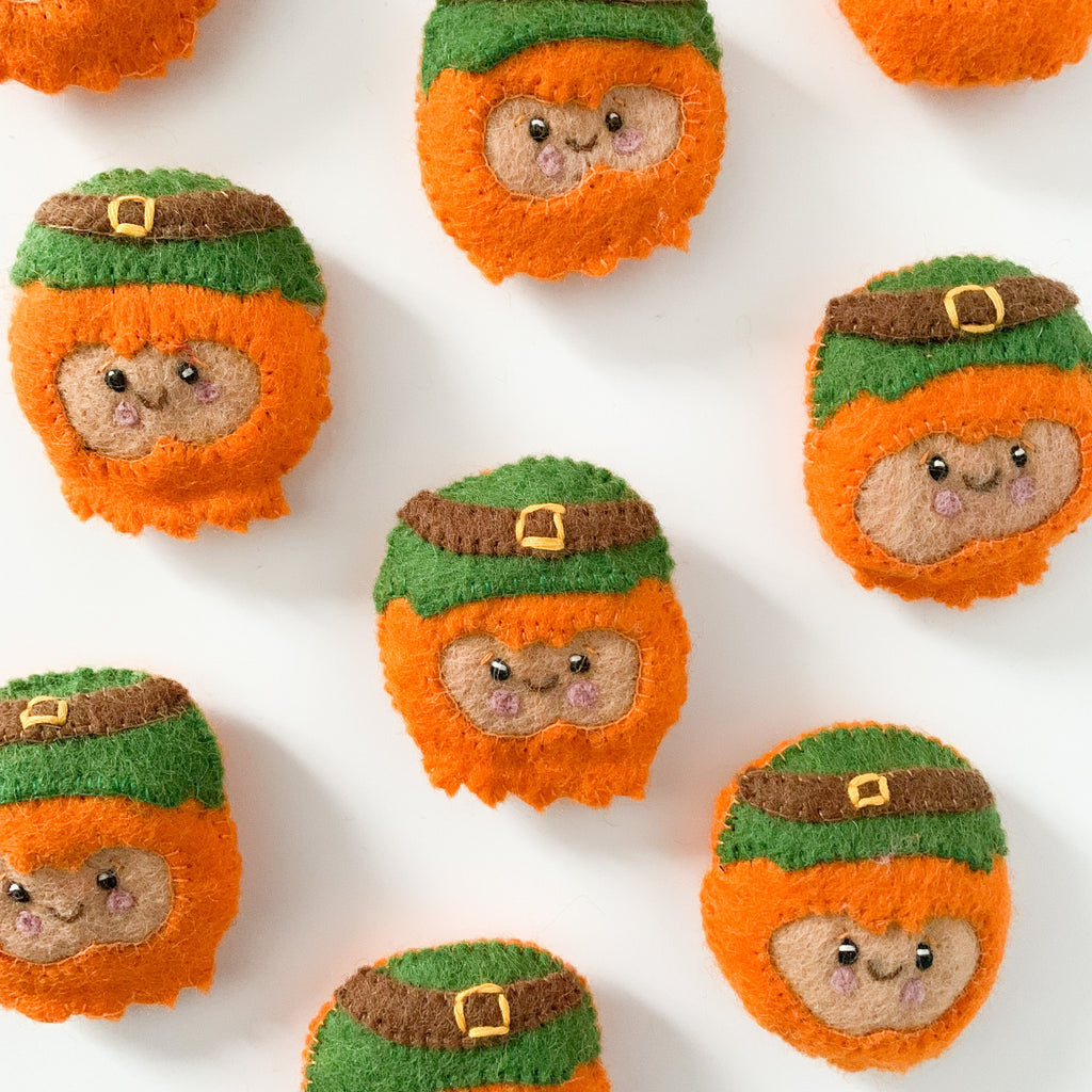 felt leprechaun face with a green hat and orange beard for crafting or sensory play 