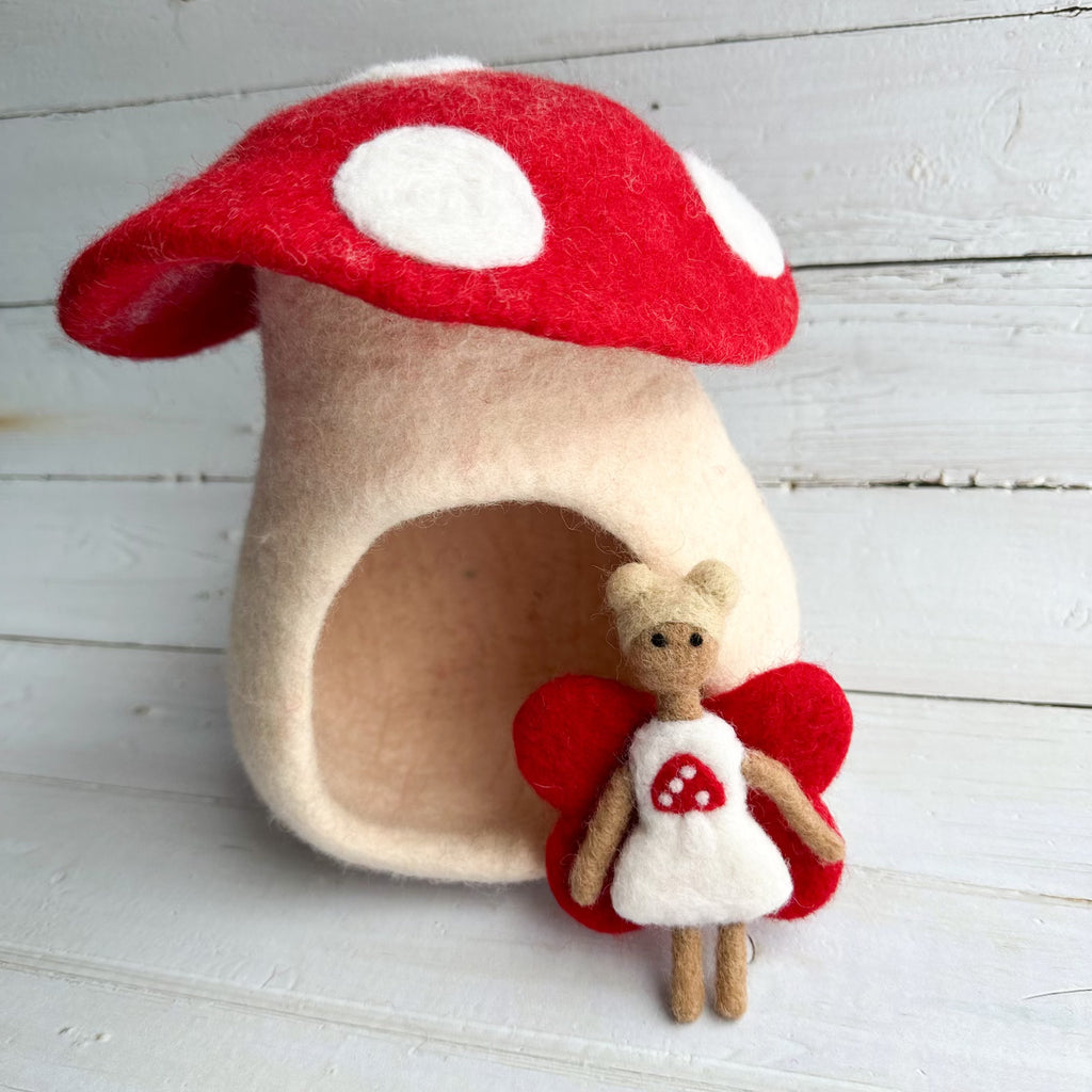 Felt toadstool mushroom play house that can be used for peg people and dolls. Available from a small shop in Canada. 
