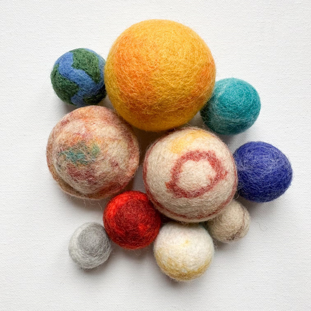 Felt planet set toys that can be used for play, decor, mobiles and garland. Available from a small shop in Canada. 