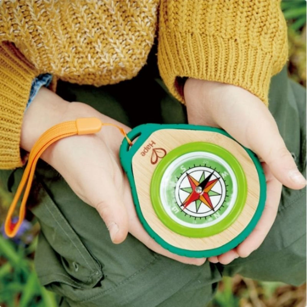 Hape play compass for children to learn direction while playing in the forest or camping 