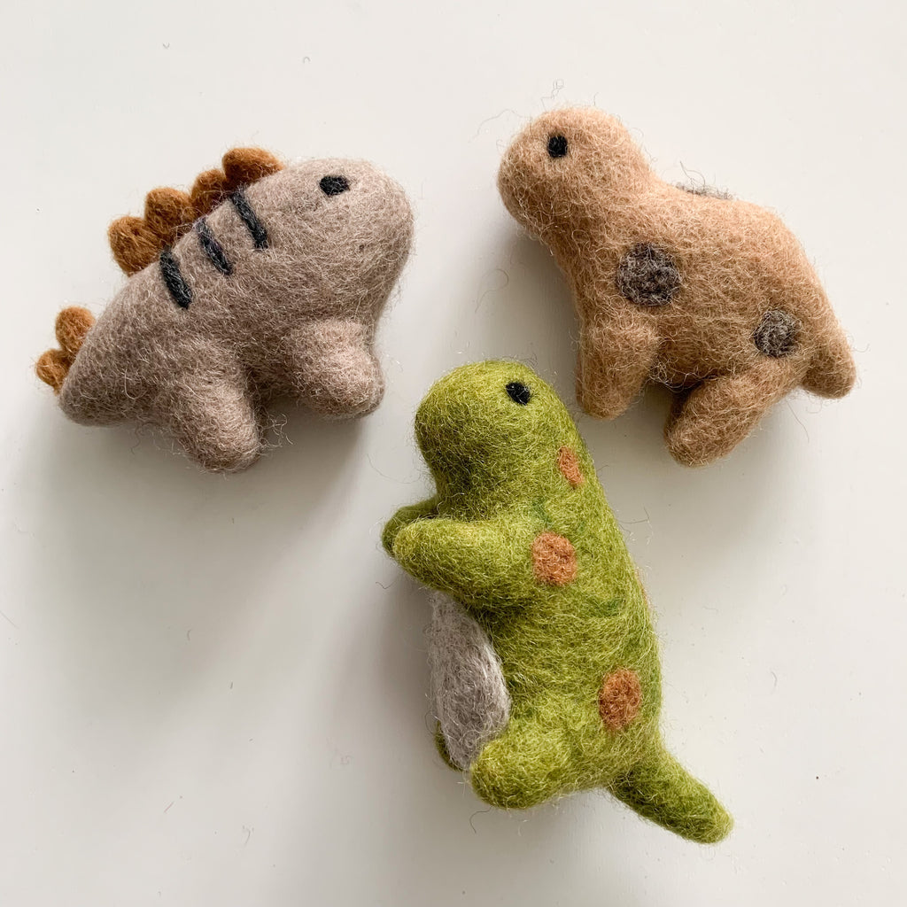 needle felt baby dinosaurs that can be used as baby room decor or for sensory play